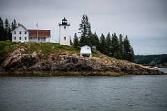 Burnt Coat Harbor Light Over Rocky Edge on a Cloudy Day